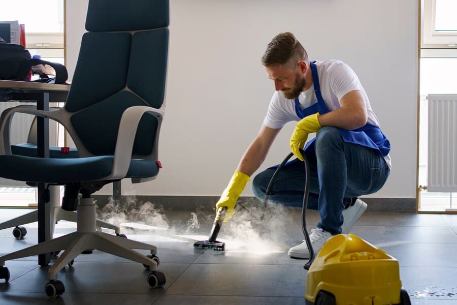 A offfice cleaner cleaning a floor